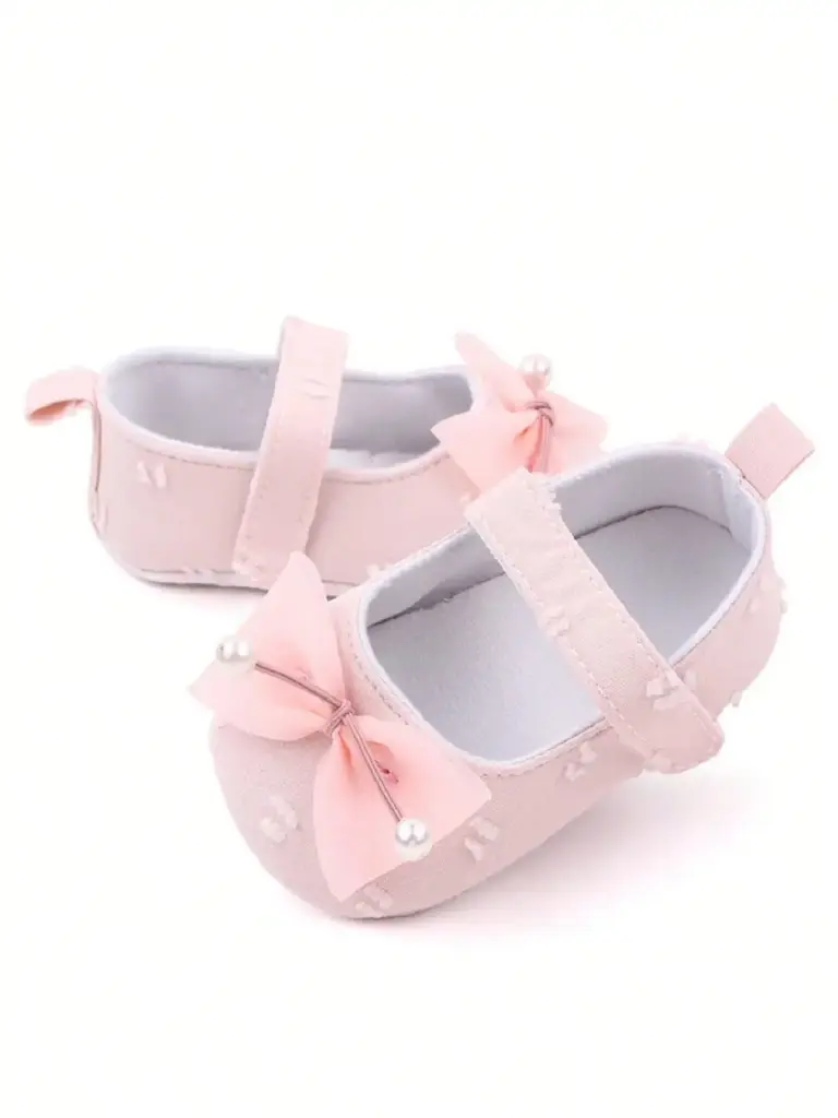 Zapatitos rosa con lazo